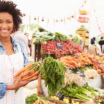 African american woman farmers market vendor
